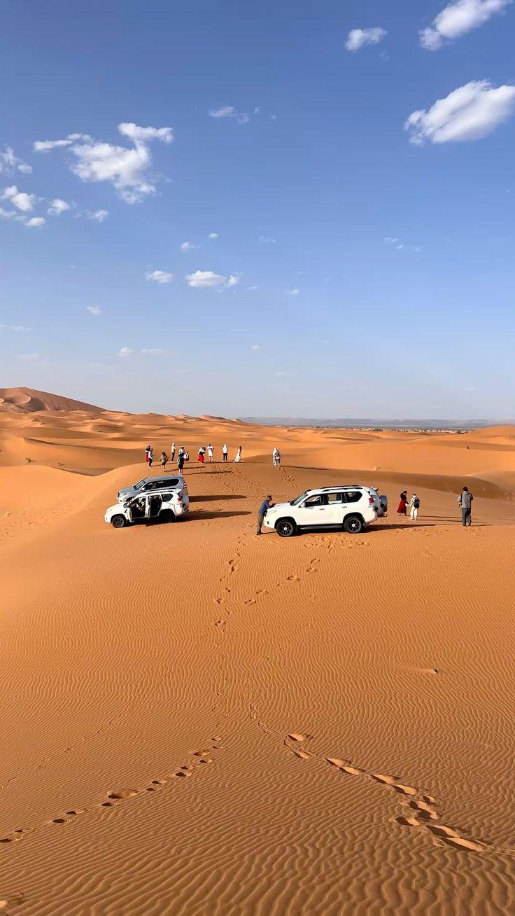 A 4x4 vehicle crossing open stony desert
