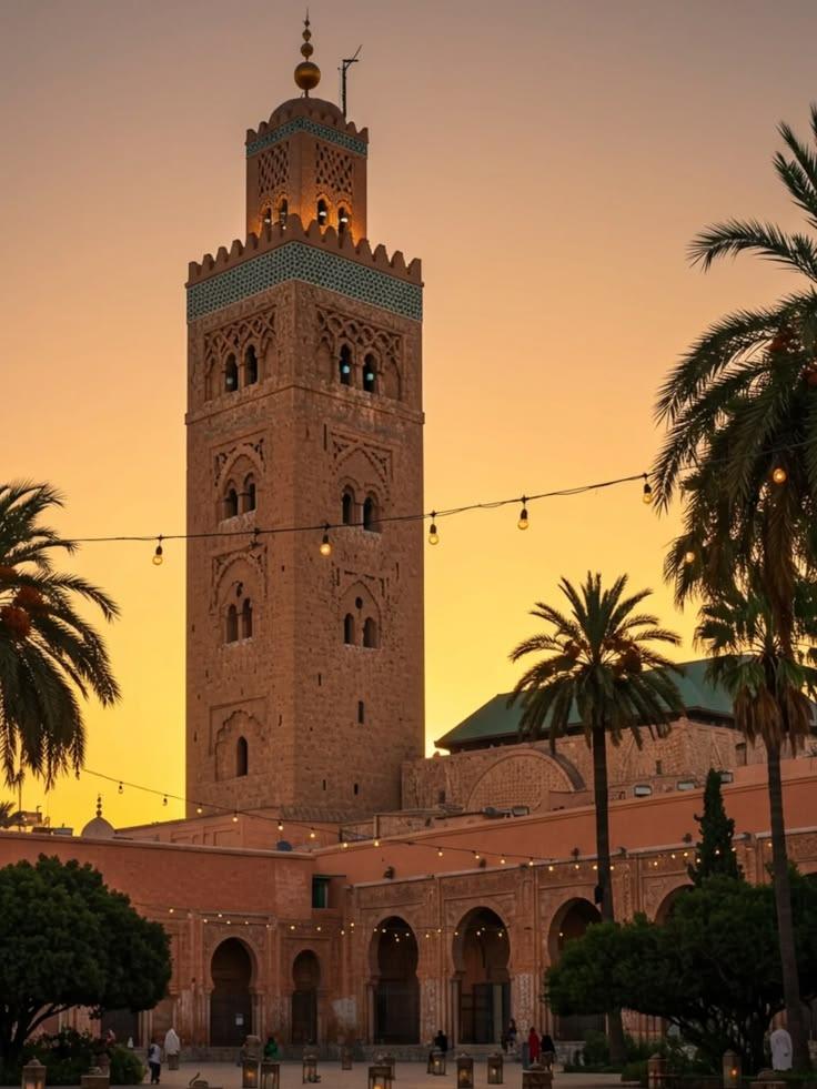 Koutoubia minaret framed by palms at sunset
